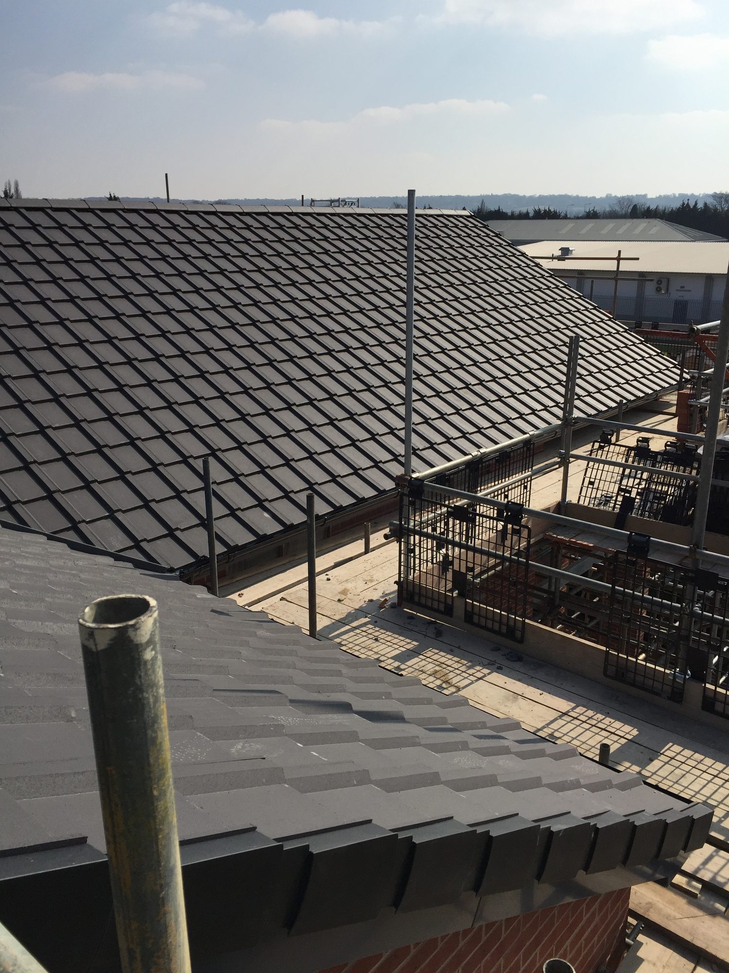 After — New-Build Wessex Grey Tiled Roof with Dry Details — Homeowner Repairs
