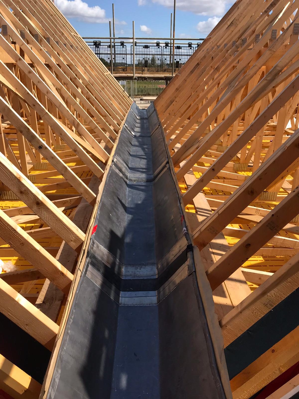 Completed - The completed lead-lined roof valley running between the timber roof structures