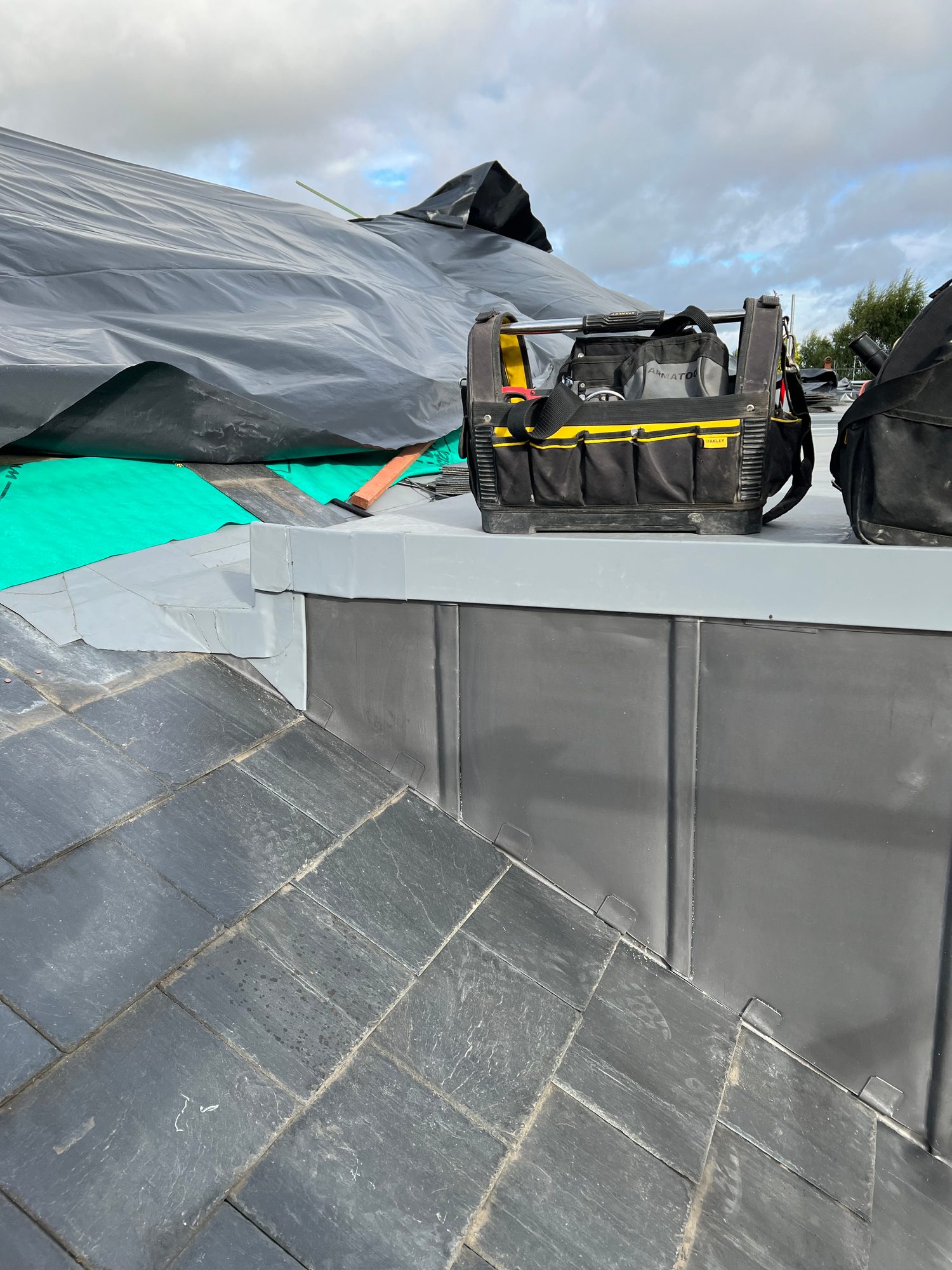 Completed - Completed slate roof with finished lead cladding and weatherproofed roof junctions