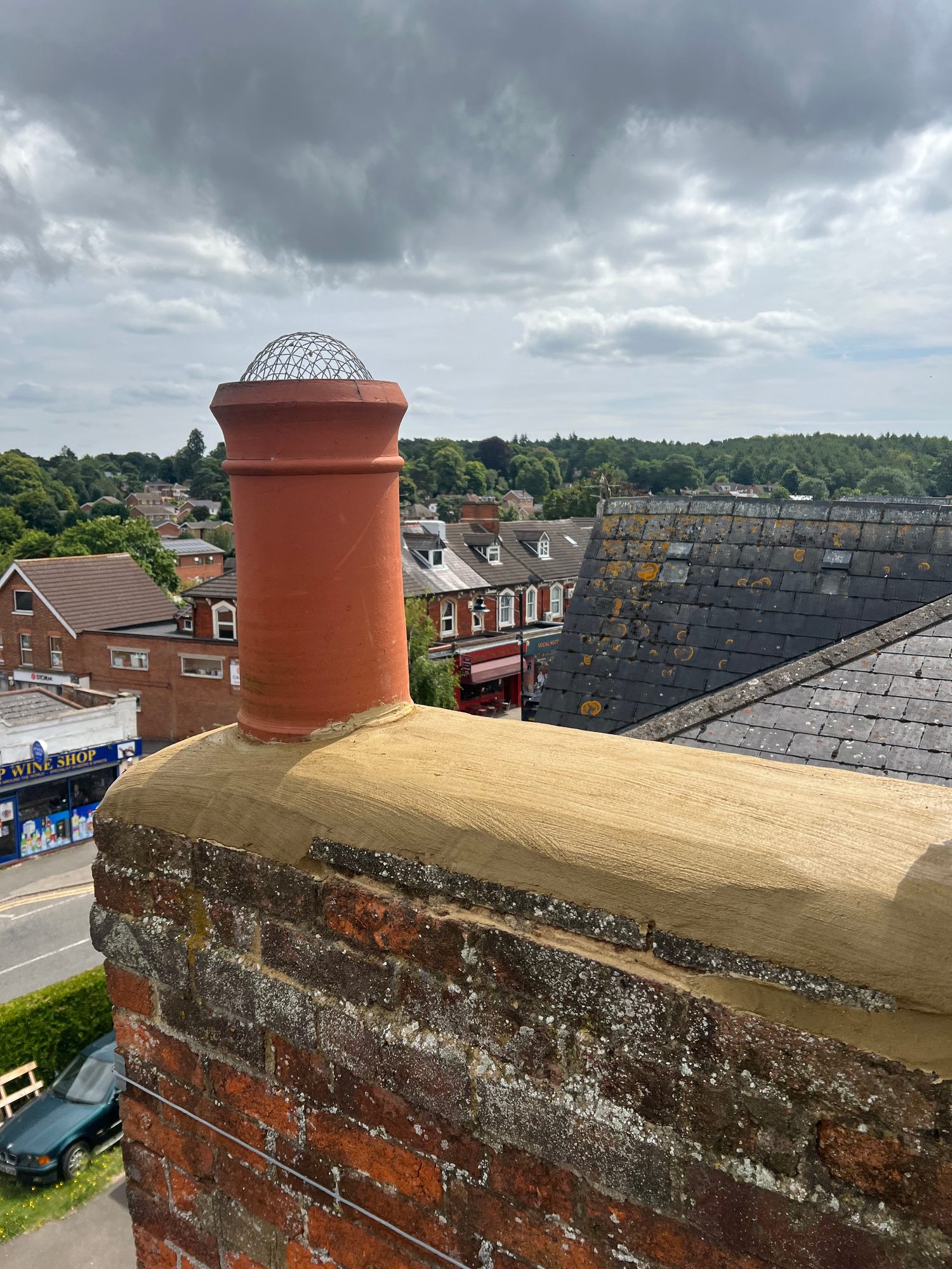 Completed - The completed chimney showing the restored mortar detailing, terracotta chimney pot and surrounding roof tiles