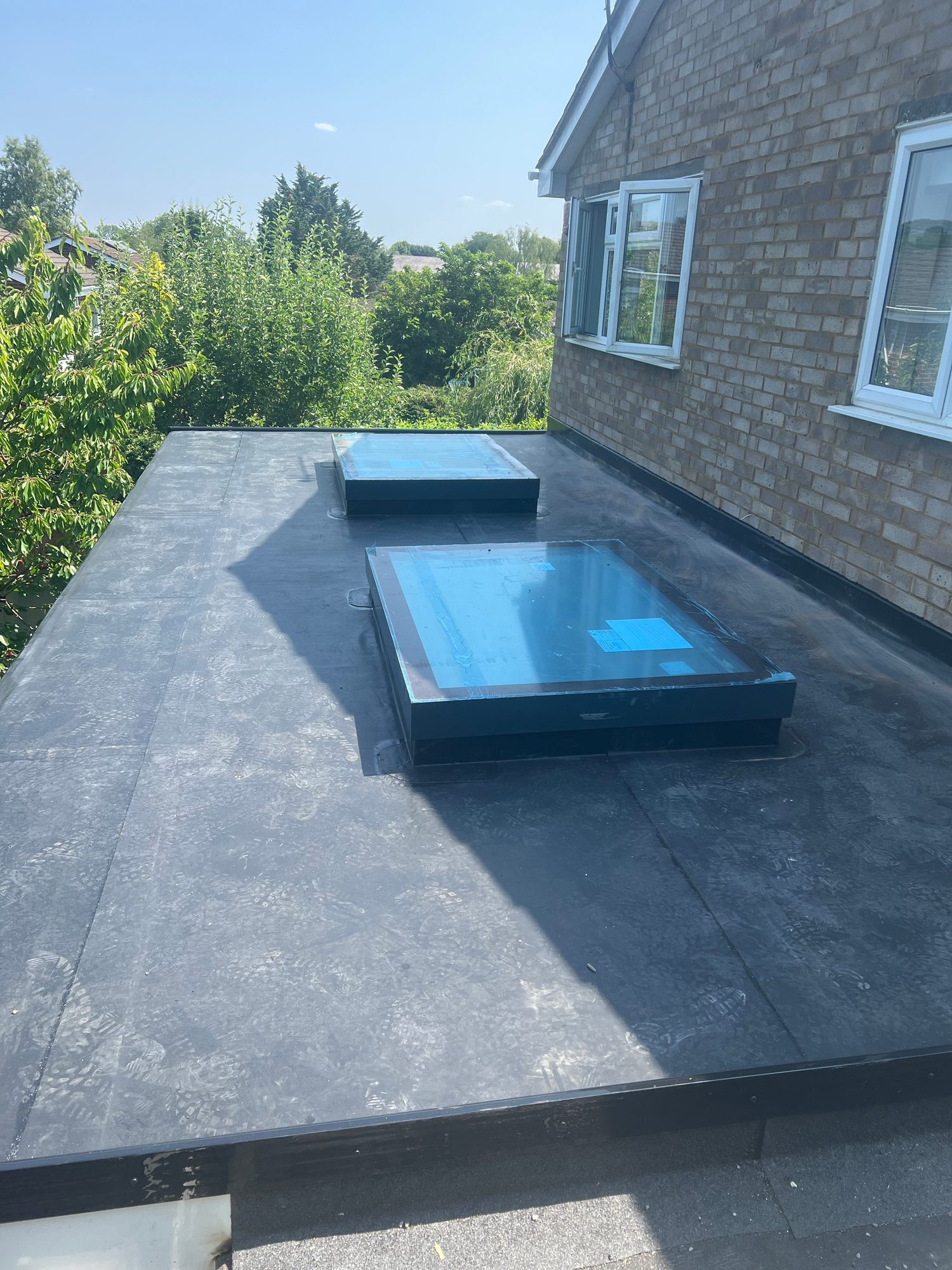 Before — Fleece-Backed EPDM Flat Roof with Two Rooflights – St Albans — Roofing