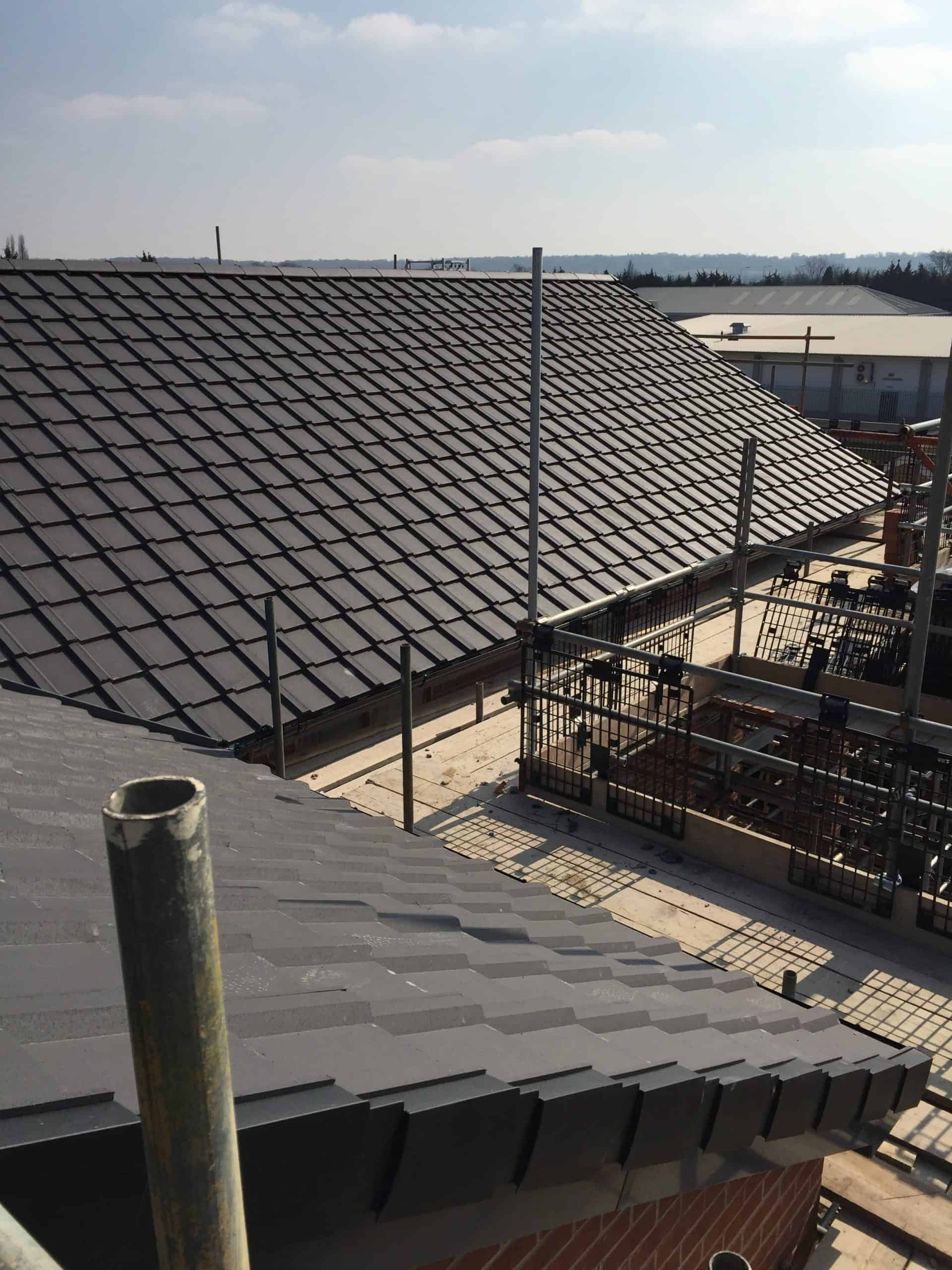 Large Roof with black tiles being built