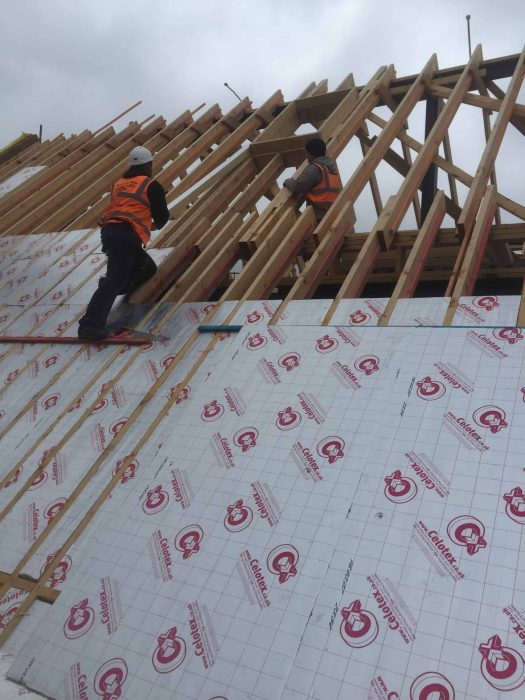 Men Building Roof